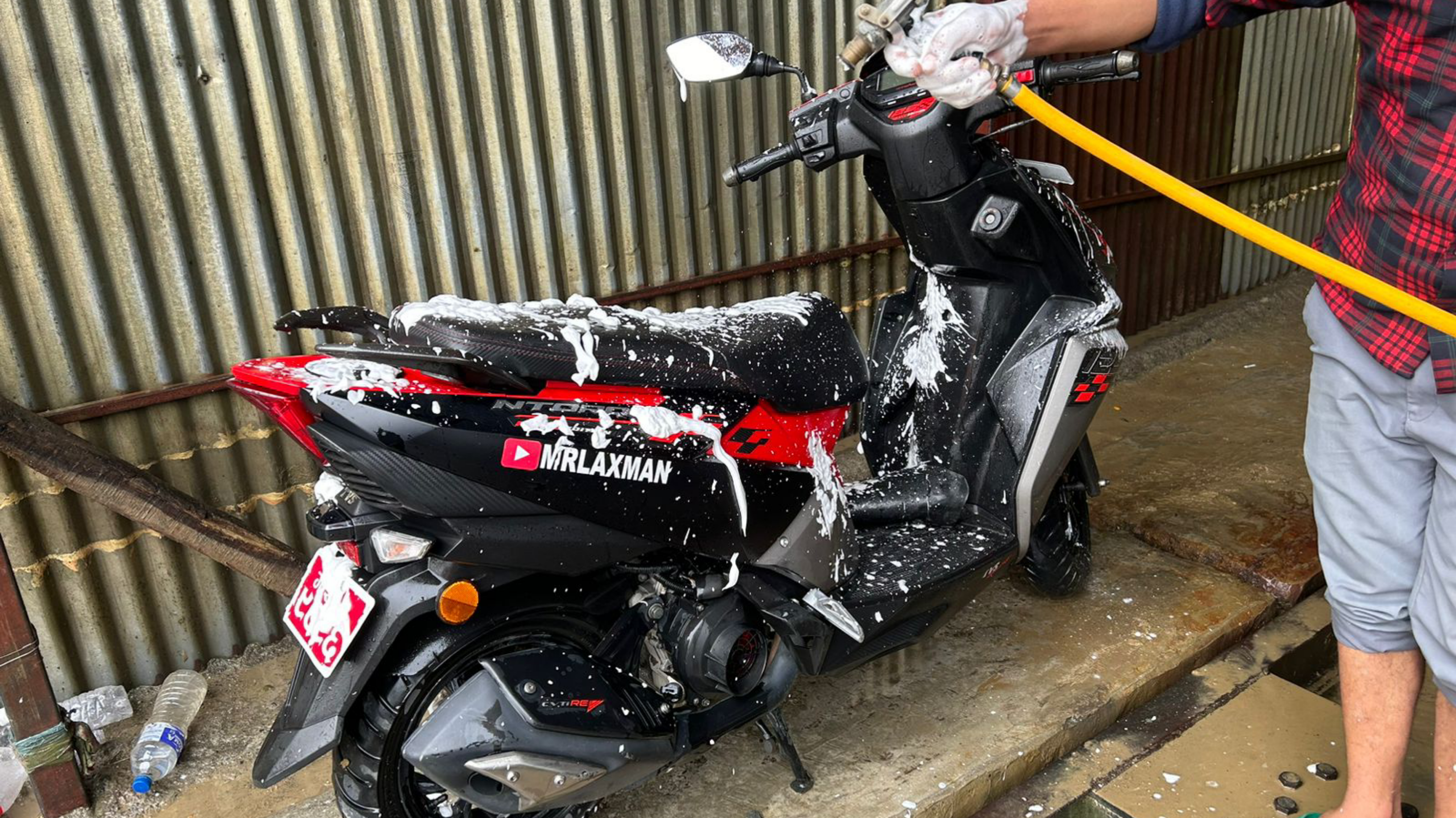 Cleaning the Scooter in Simpani  