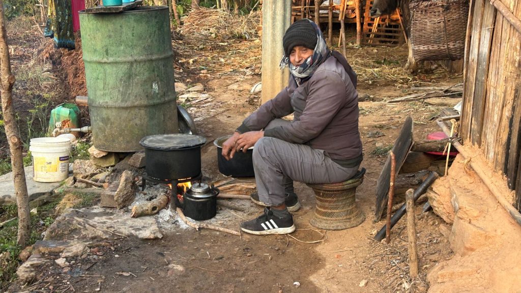 Father Is Making A Fire In Taksar Village