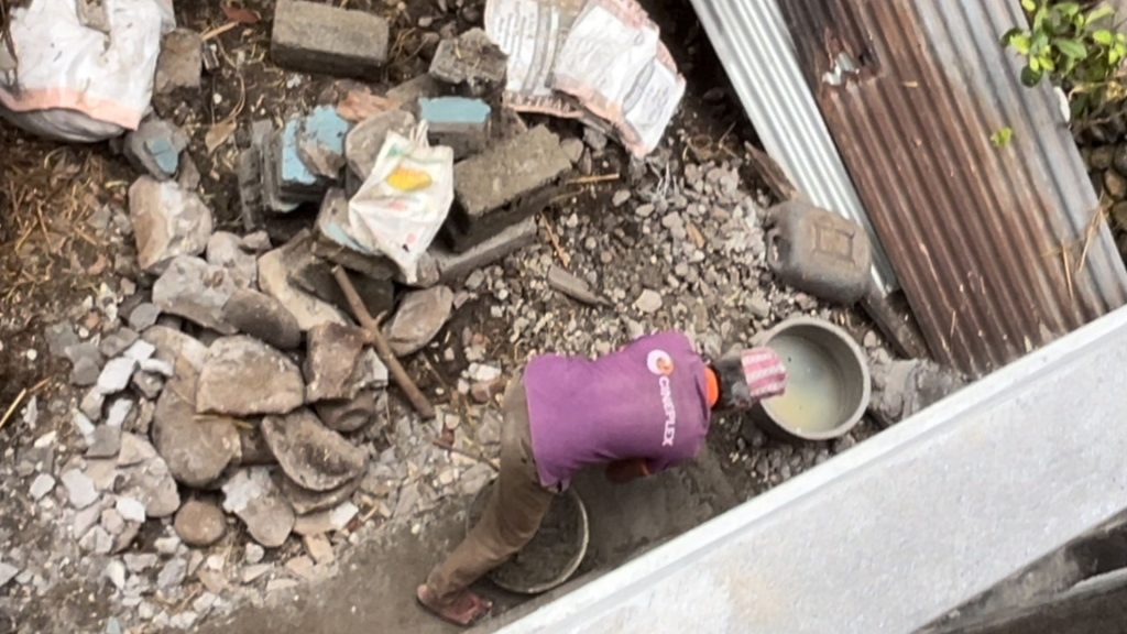 The Worker Was Fixing The House's Drain